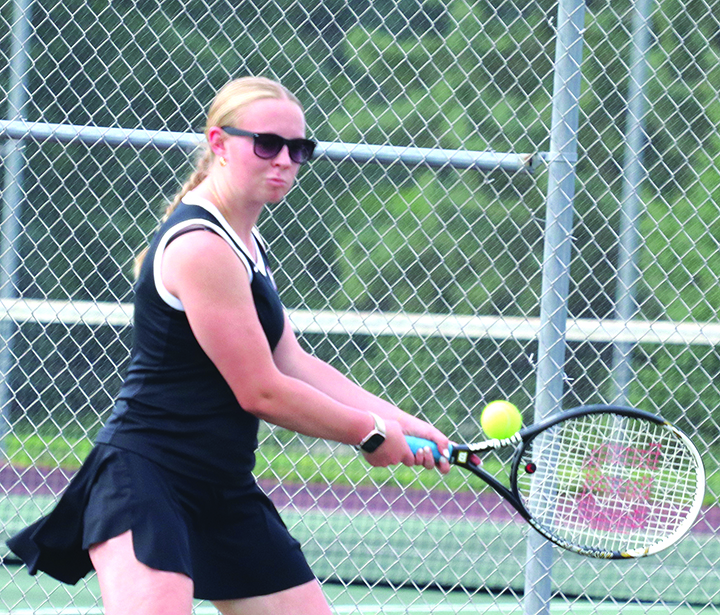  Allison Retzlaff hits the ball back to her opponent.